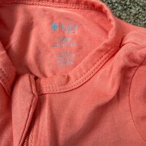 Kyte Baby Coral zip romper
